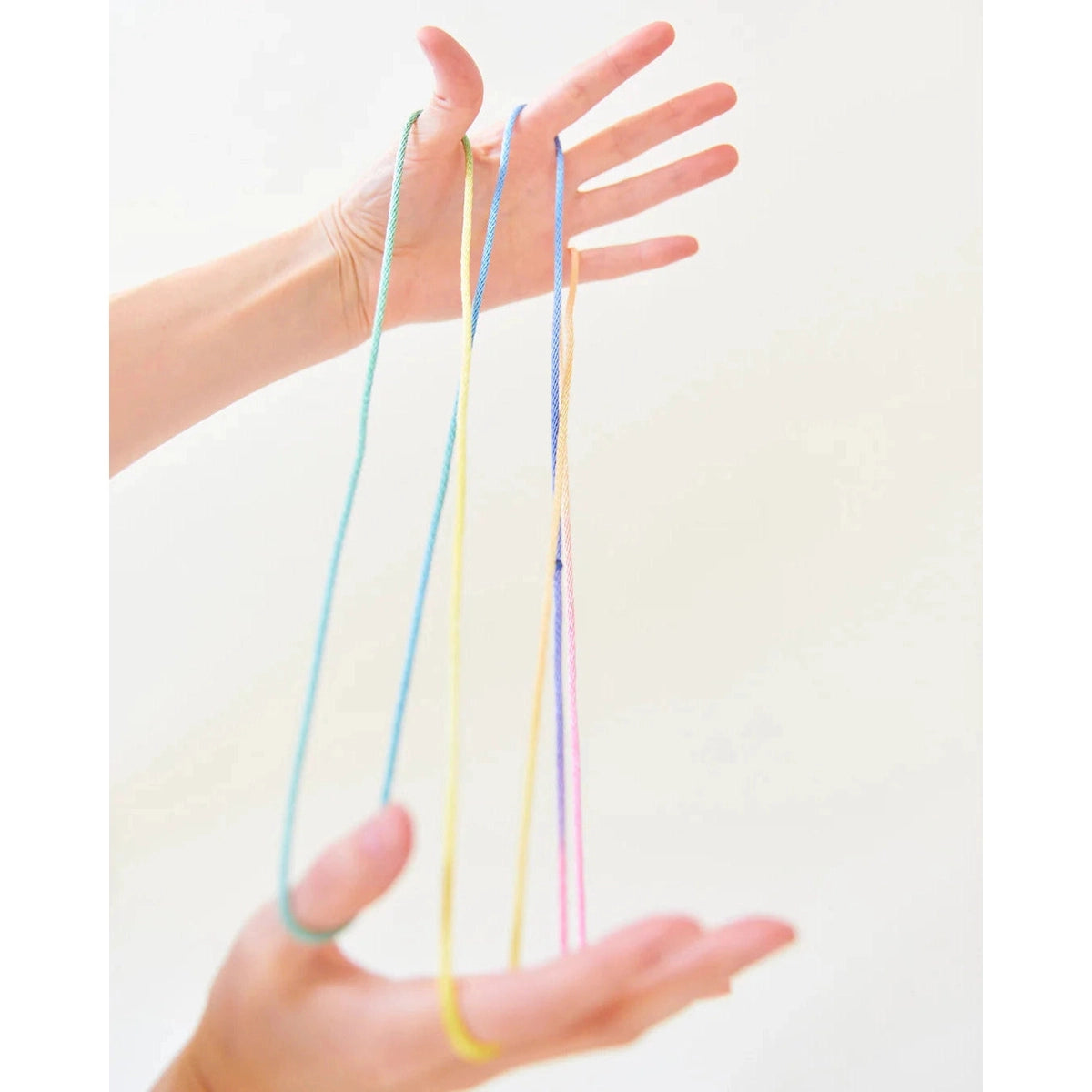 ---Sarah's Silks rainbow string game